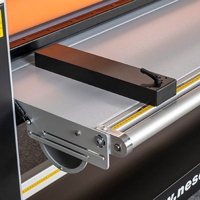 Neschen ColdLam 1650 infeed table with alignment guides