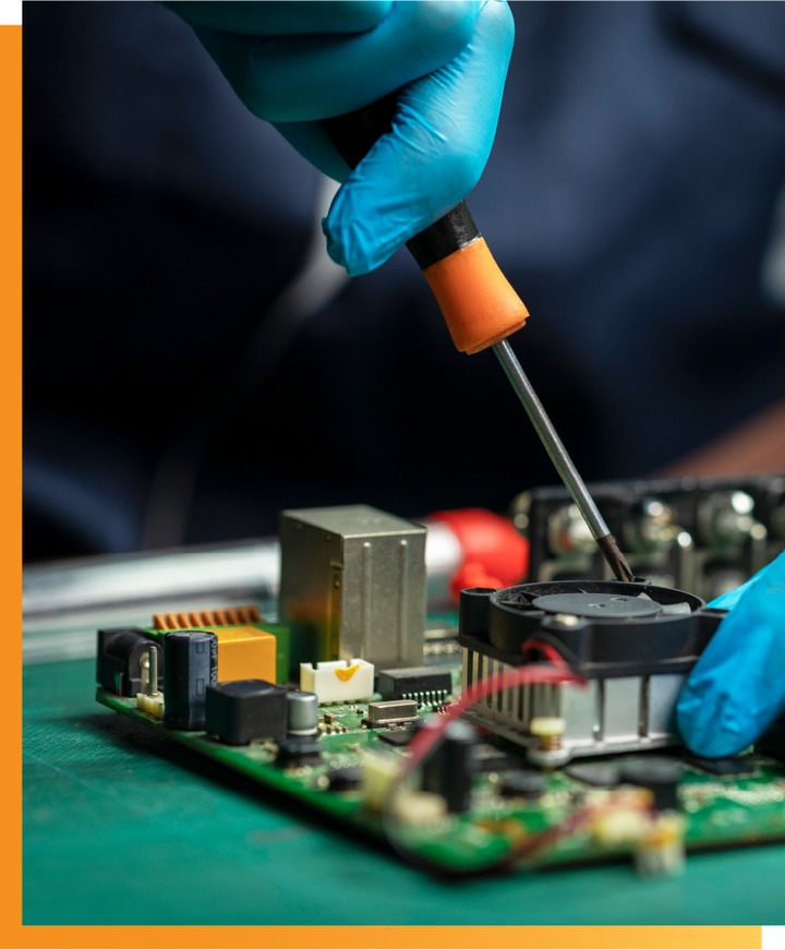 Technician assembling a PCB with precision tools during prototype build at Ninja Circuits facility