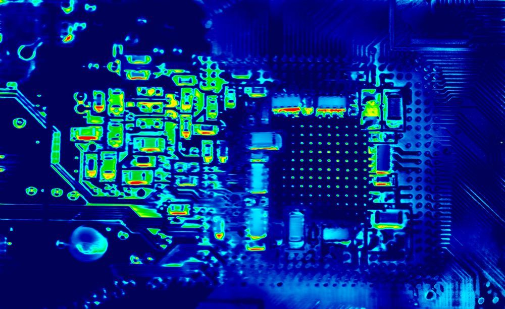 Abstract blue and green circuit board pattern with glowing electronic components and traces