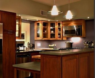 A kitchen with wooden cabinets and stainless steel appliances