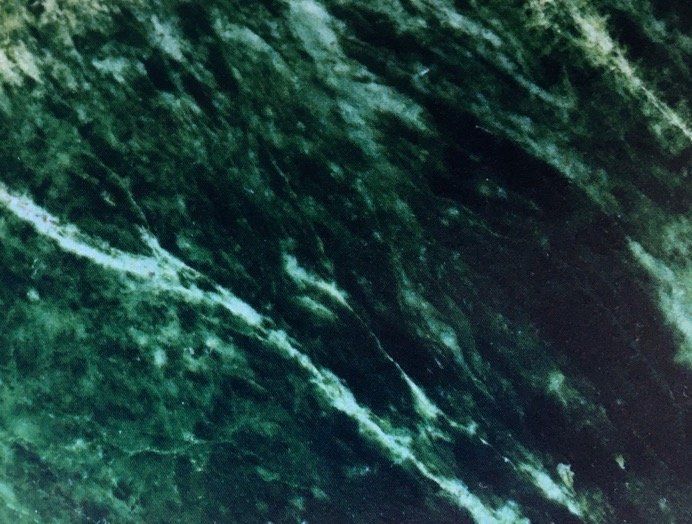 A close up of a green marble texture
