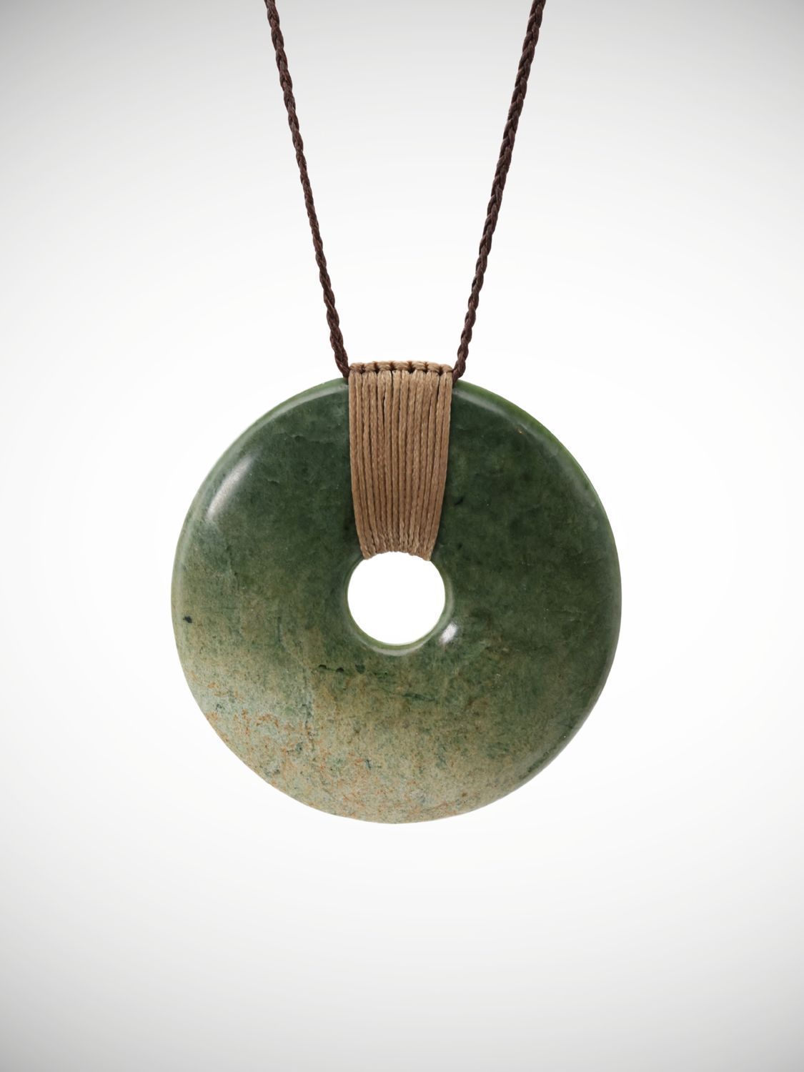 Greenstone Porohita disk pendant meaning