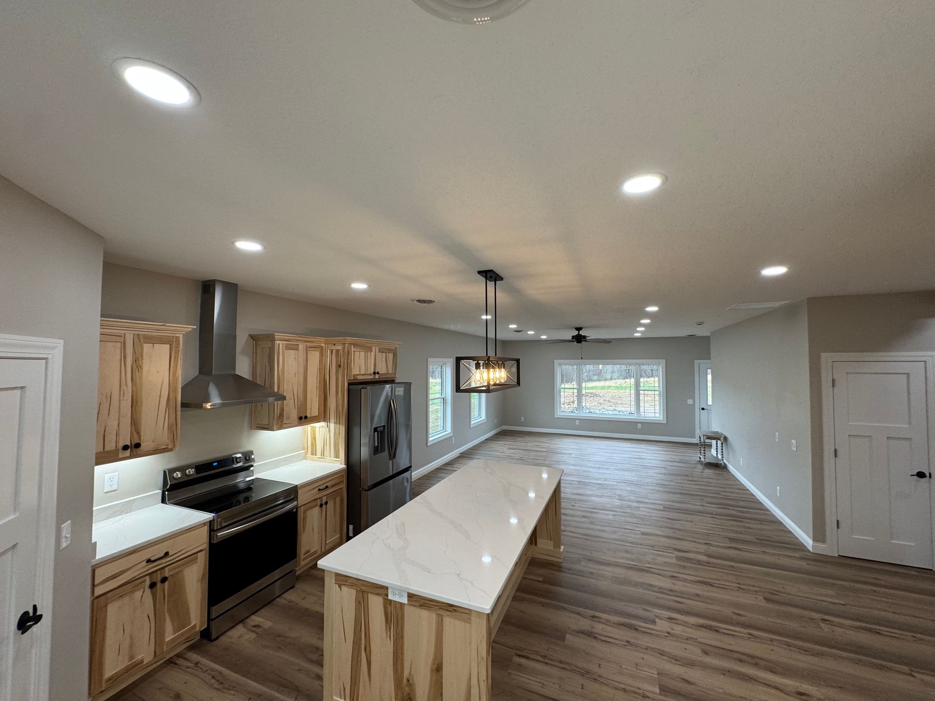 There is a large island in the middle of the kitchen.