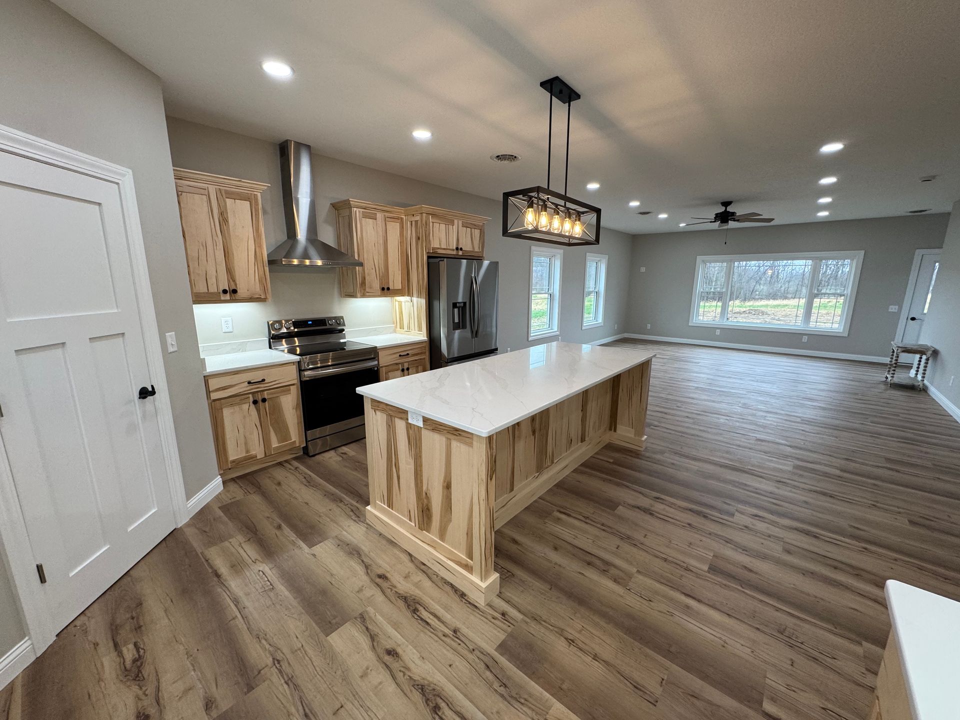 There is a large island in the middle of the kitchen.