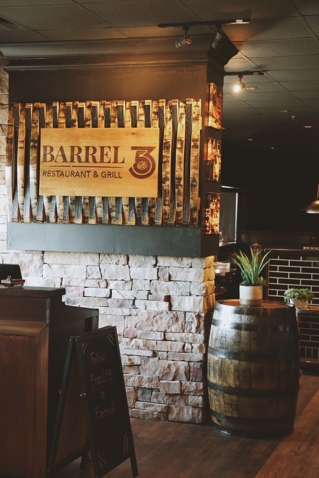 A restaurant with a sign that says barrel 3 on it