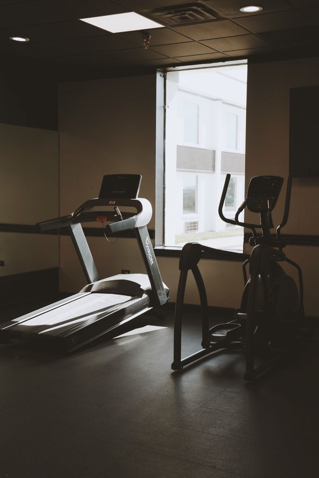 There are two treadmills and an elliptical in the gym.
