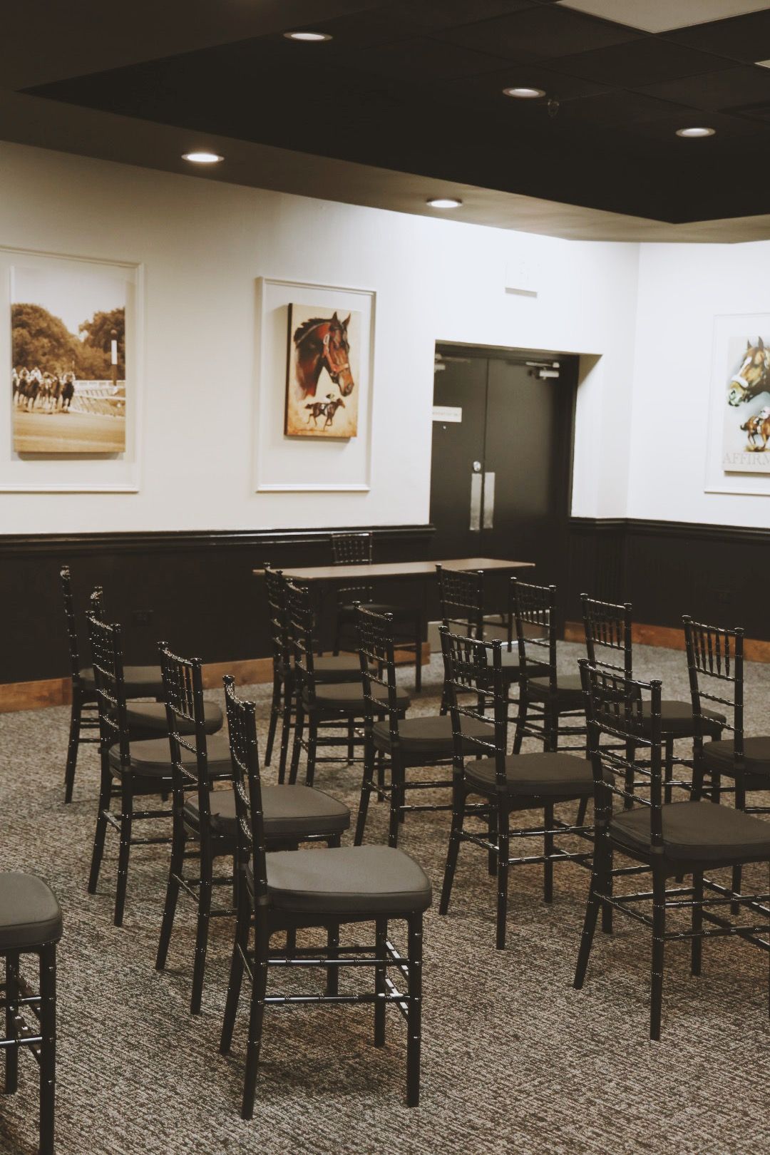 A room with a lot of chairs and tables