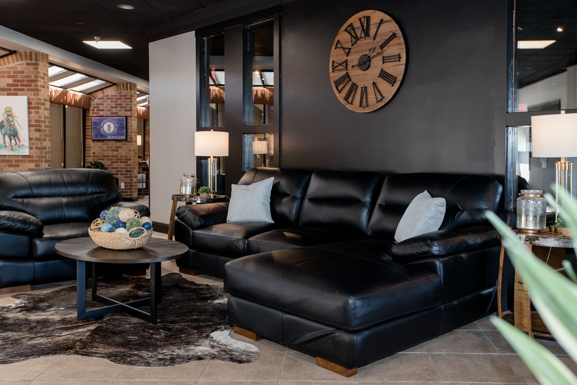 A living room filled with furniture and a clock on the wall.
