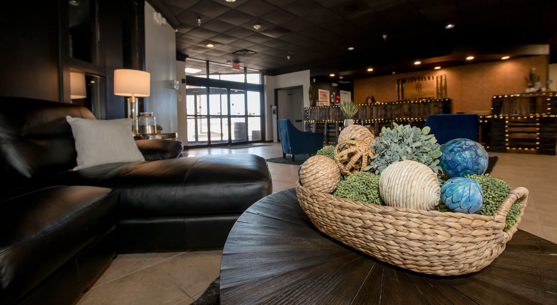 A living room with a couch and a basket on a table.