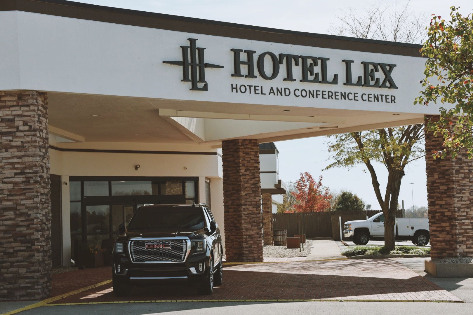 A car is parked in front of the hotel lex hotel and conference center