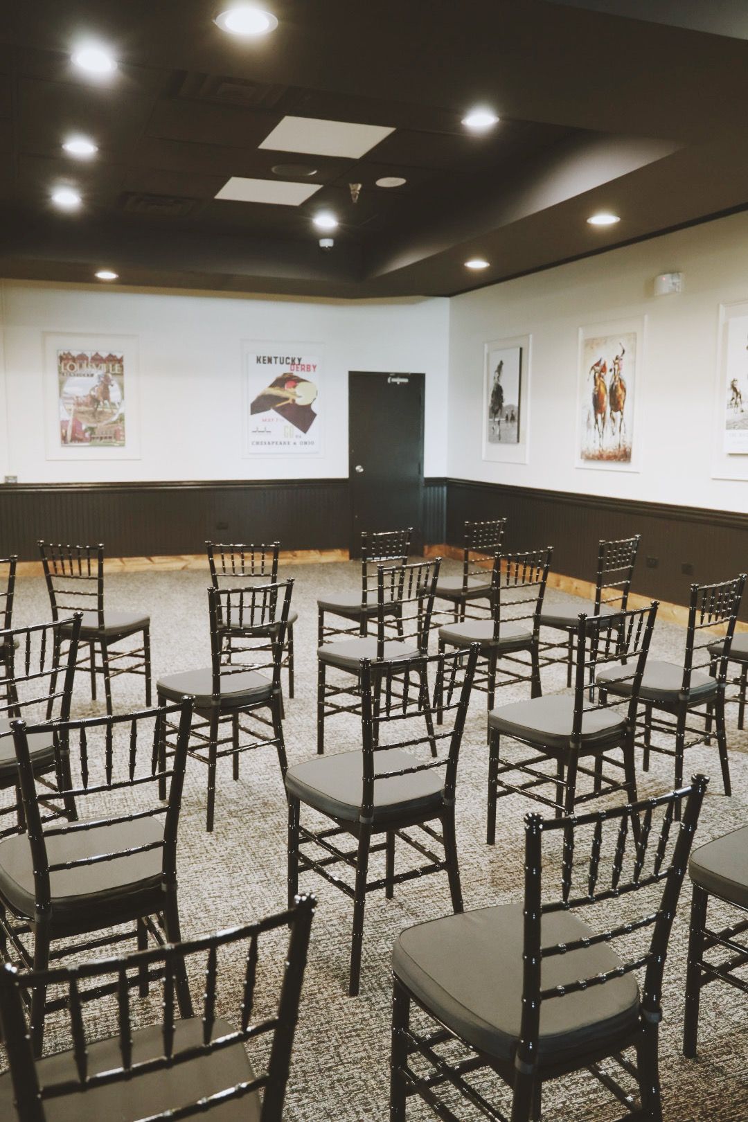 A room filled with lots of chairs in a circle.