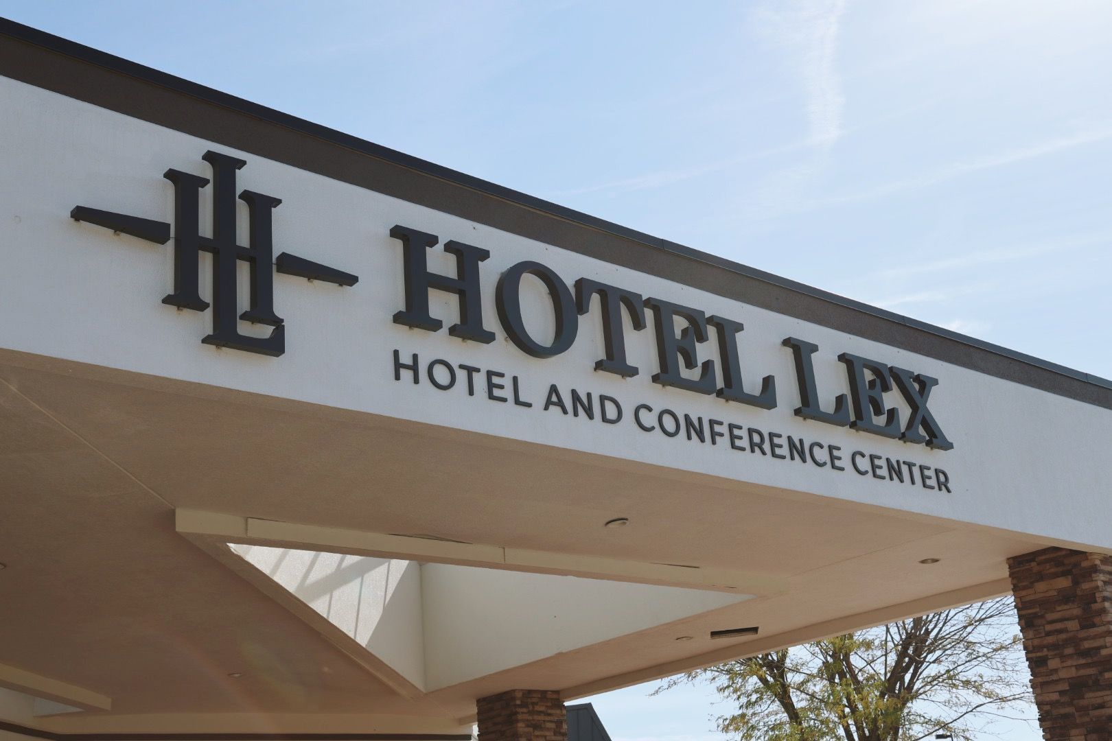 A sign for the hotel lex hotel and conference center