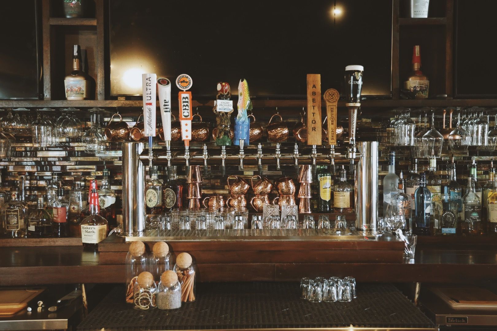 A bar with a lot of beer taps on it