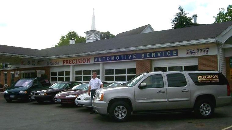 A Couple of Vehicles in Front of Precision Automotive Service in Endicott, NY