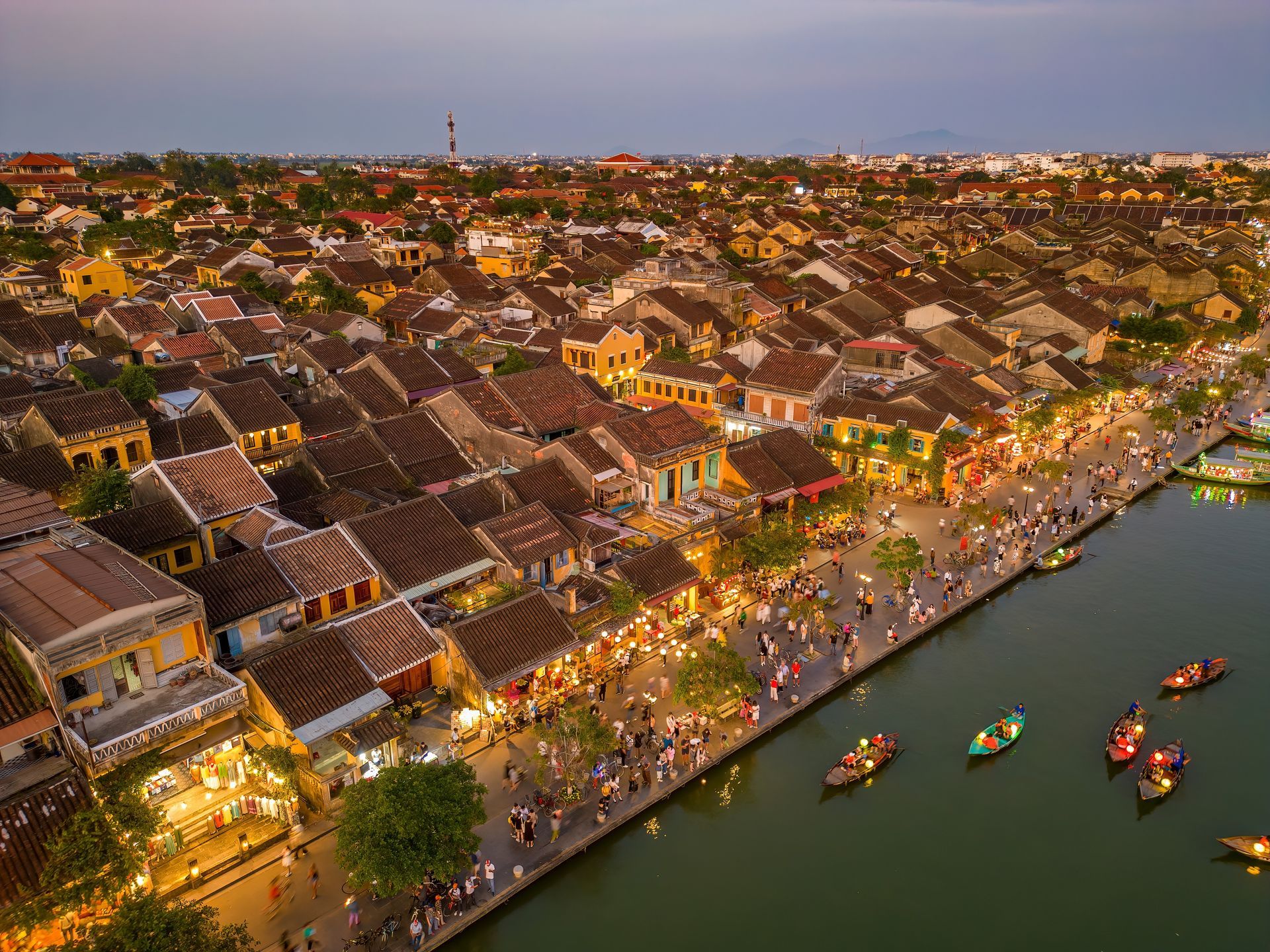 Hoi An is a UNESCO World Heritage site celebrated for its yellow-walled merchant houses, custom tailors, and hundreds of silk lanterns illuminating the Thu Bon River at night.