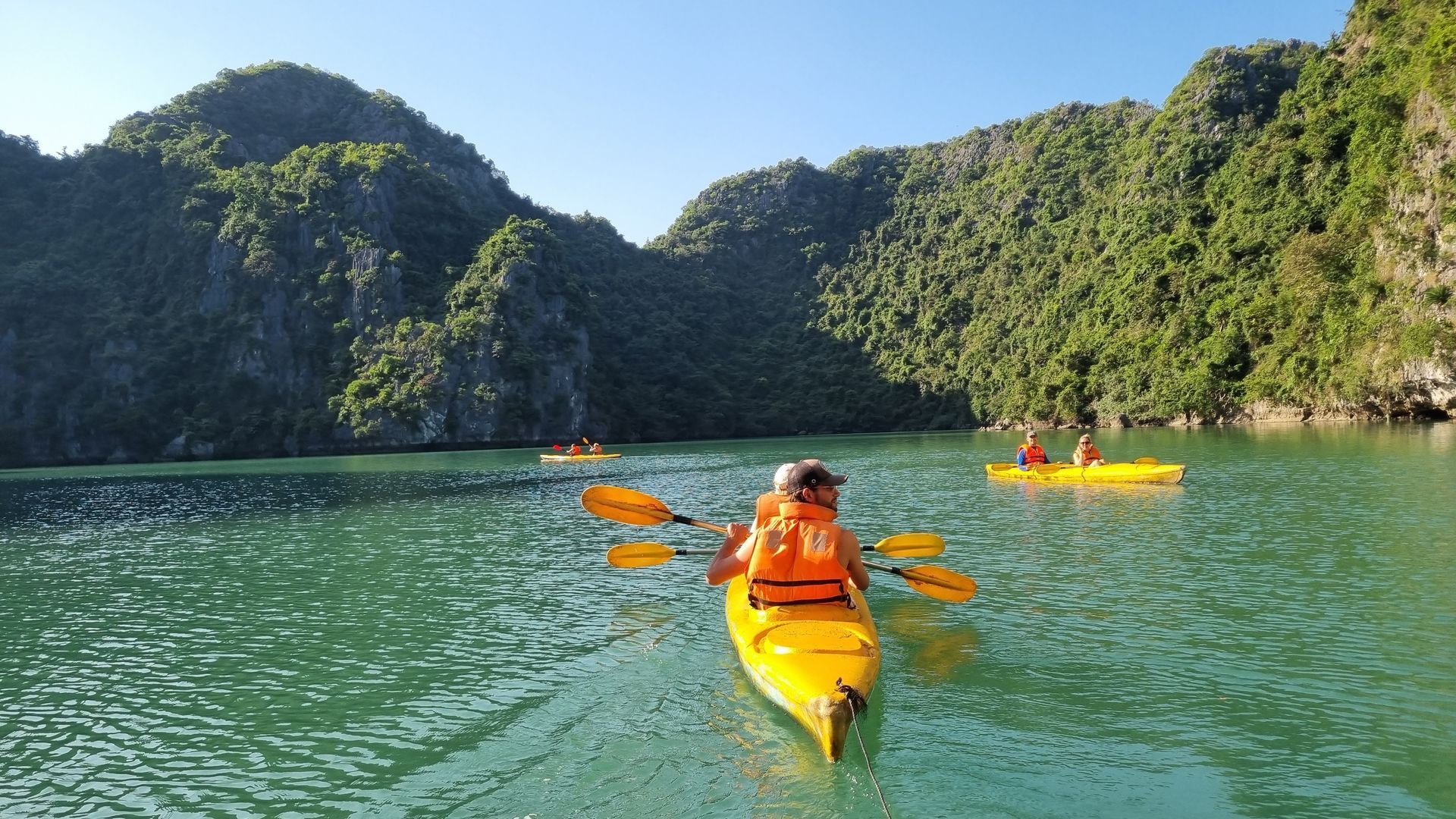 Kayak through limestone caves and relax on the sun deck surrounded by emerald waters. 