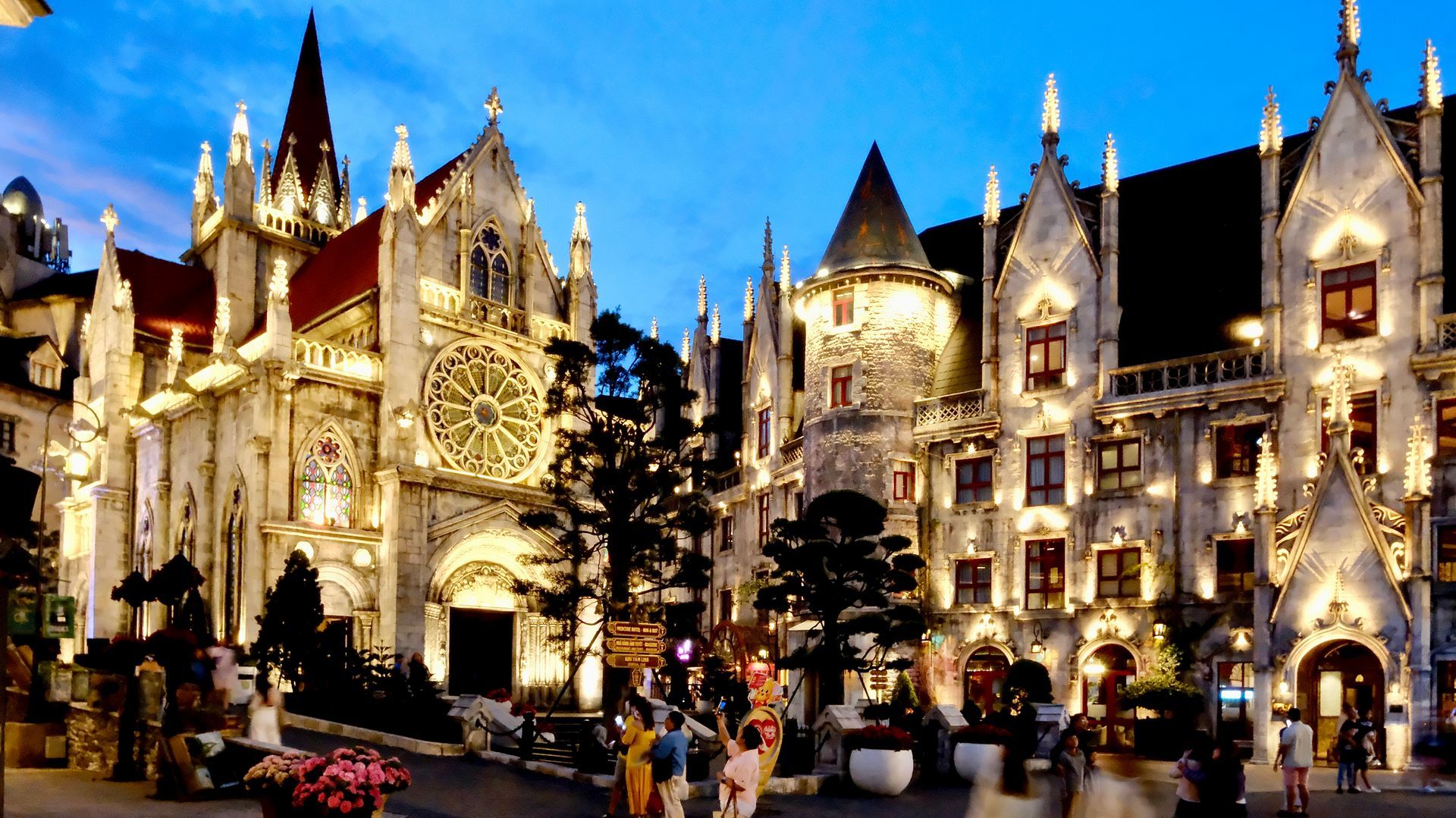 Mercure Hotel and Saint Denis Church sparkle with dazzling lights at night.