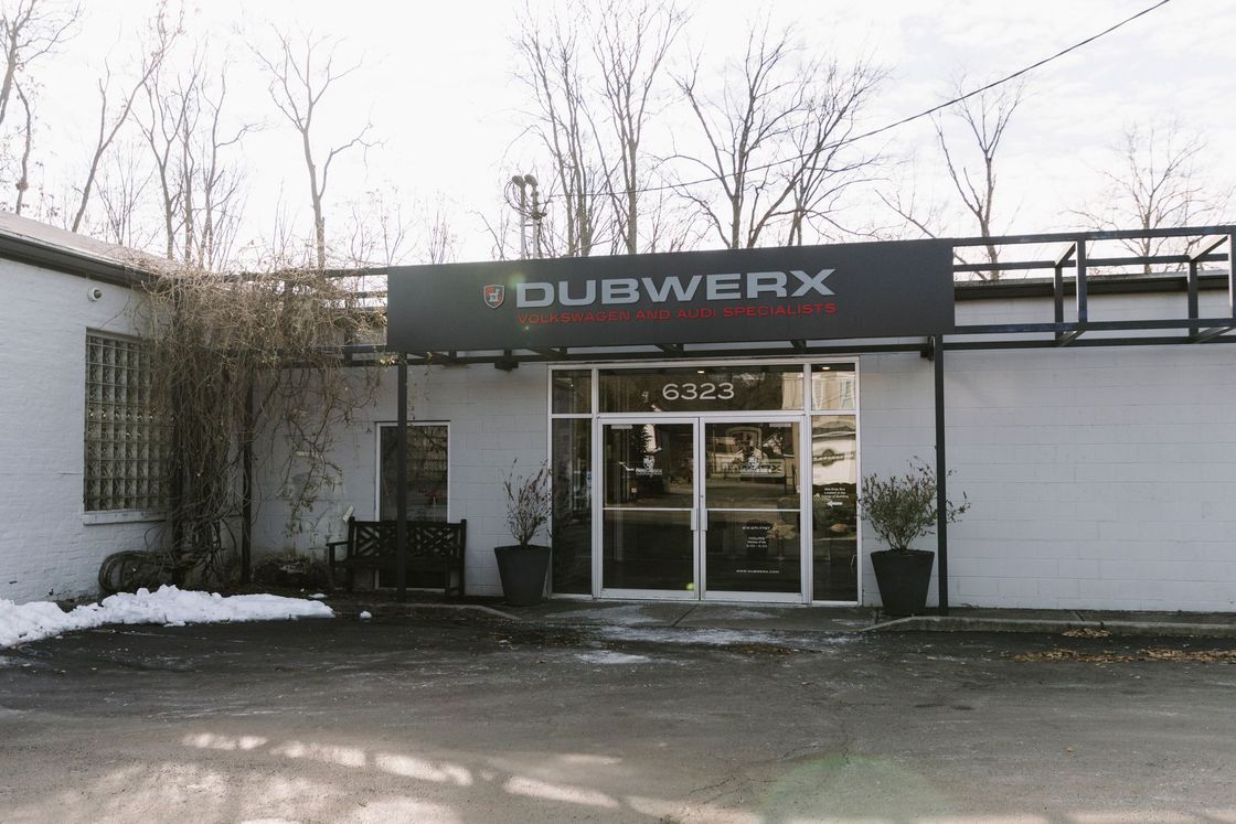 Snowy storefront with glass doors and a dark sign reading “BUBWERX” above the entrance