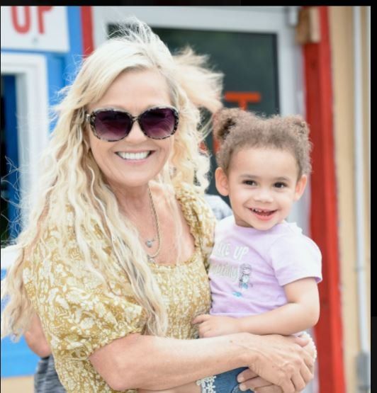 Woman holding young girl