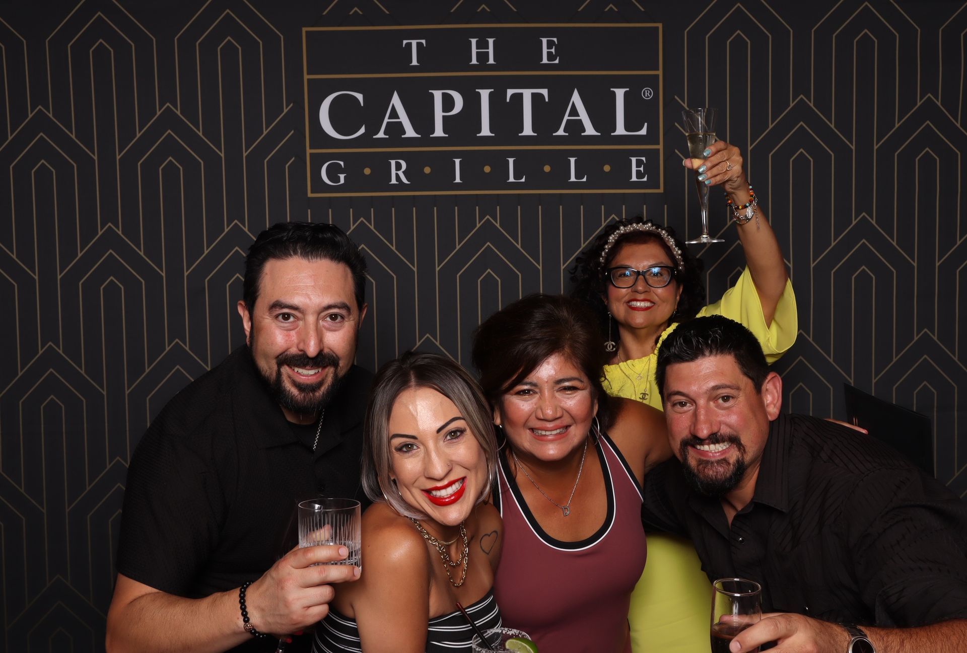 Guests celebrating with drinks during The Capital Grille San Antonio one-year anniversary event