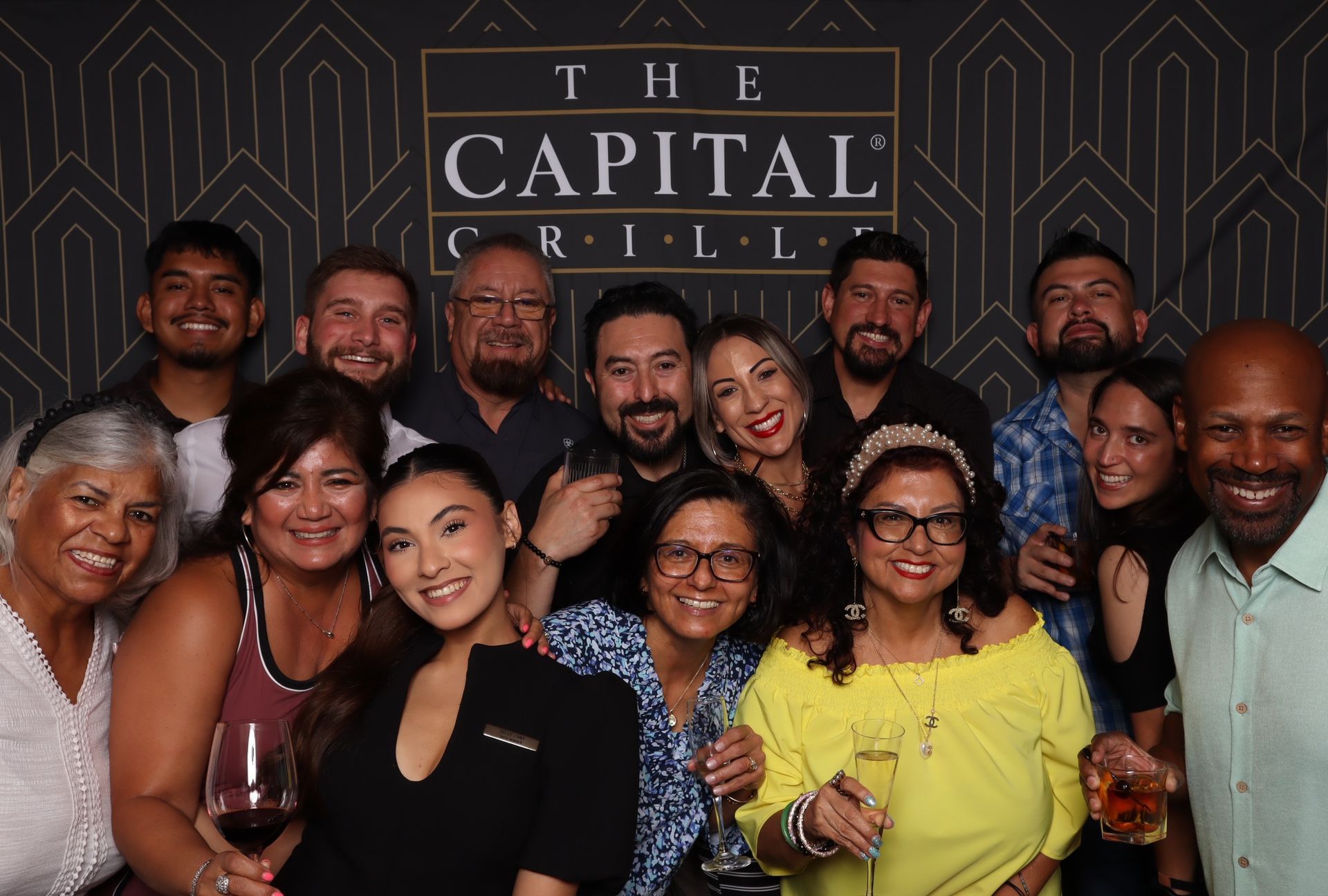 Guests celebrating with drinks during The Capital Grille San Antonio one-year anniversary event