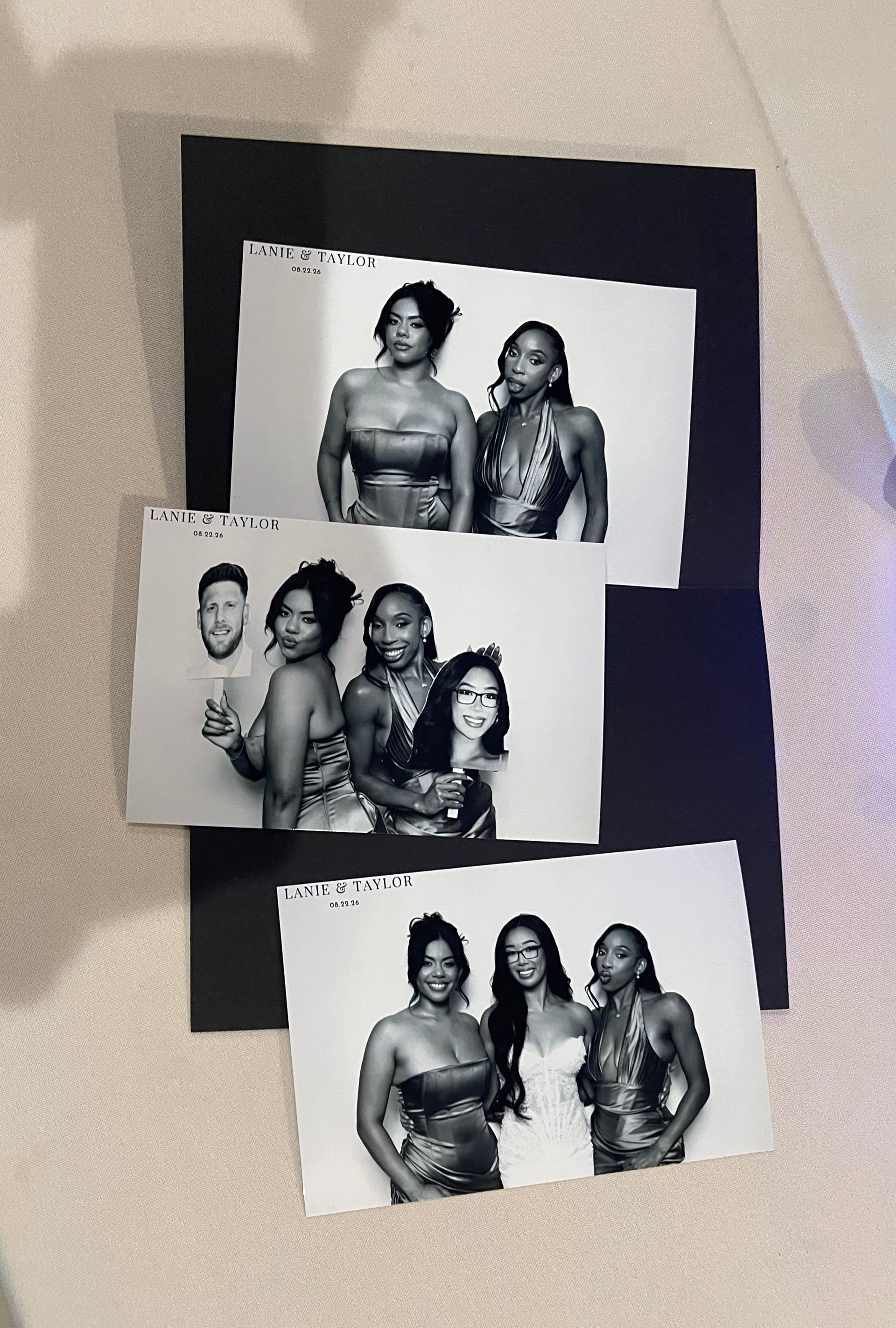 Collection of printed Glam photographs displayed on the reception table