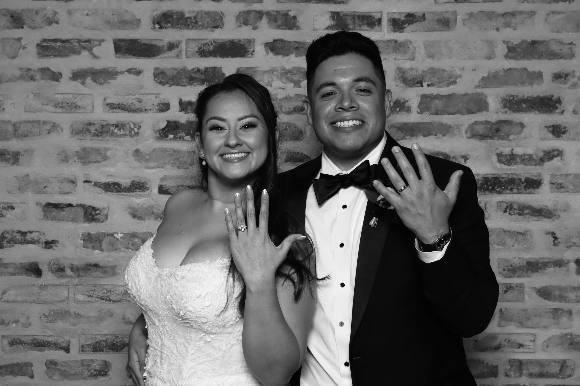 Bride and groom posing in luxury wedding photo booth experience