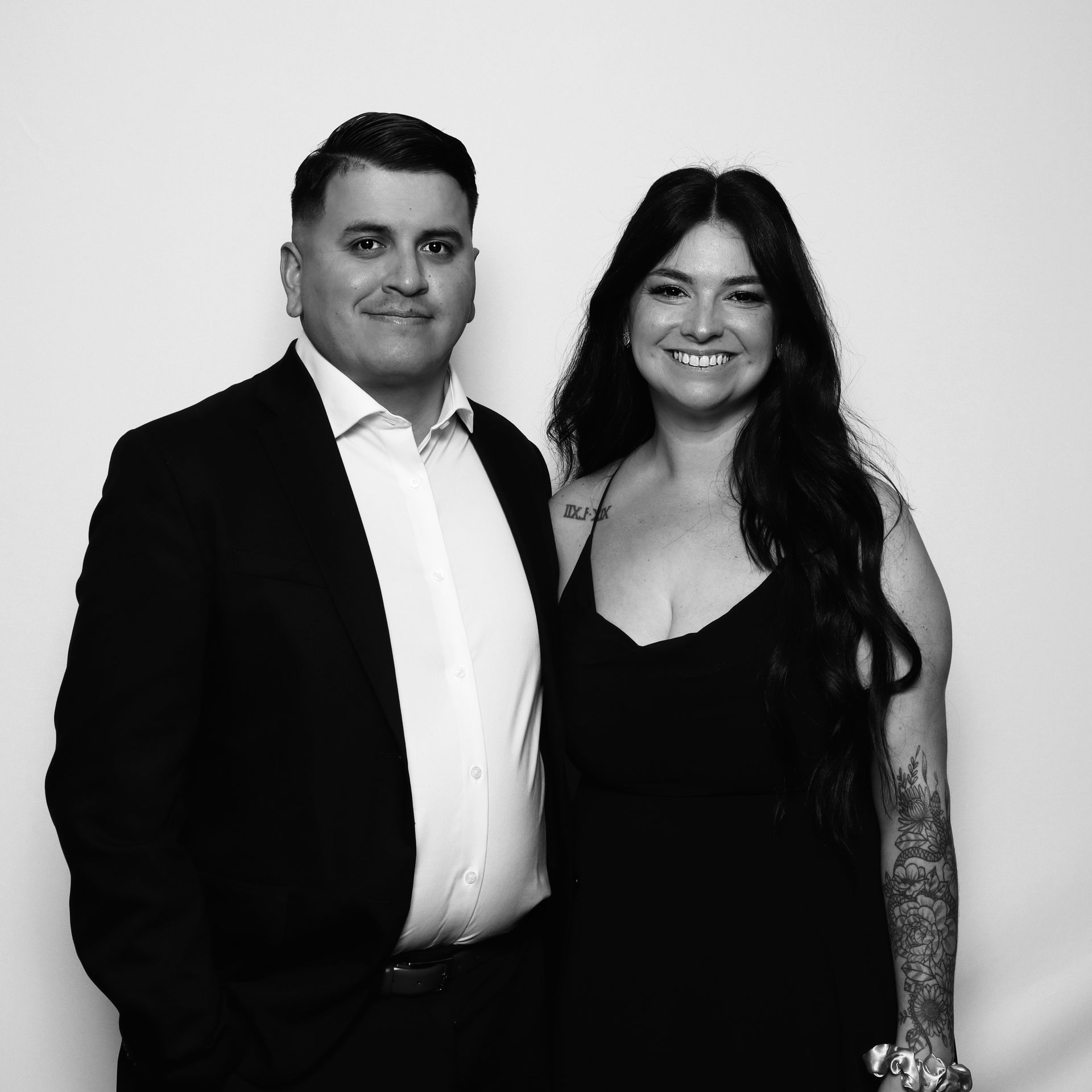 Corporate event attendees enjoying black and white glam booth activation