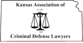 A black and white logo for kansas association of criminal defense lawyers