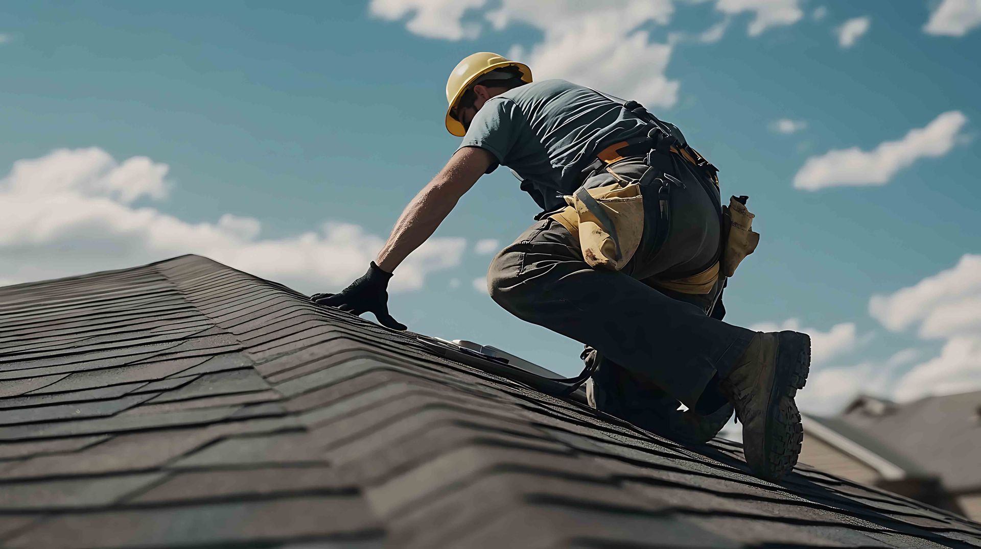 Roofing contractor repairing shingles on a residential home. Roofing contractor repairing shingles on a residential home.