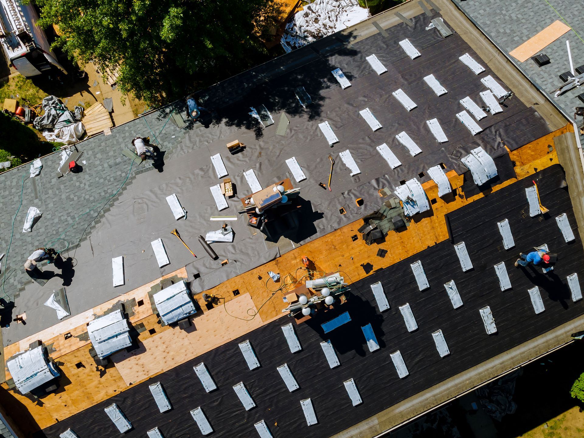 Old roof removal and new roof shingle installation with durable roofing materials