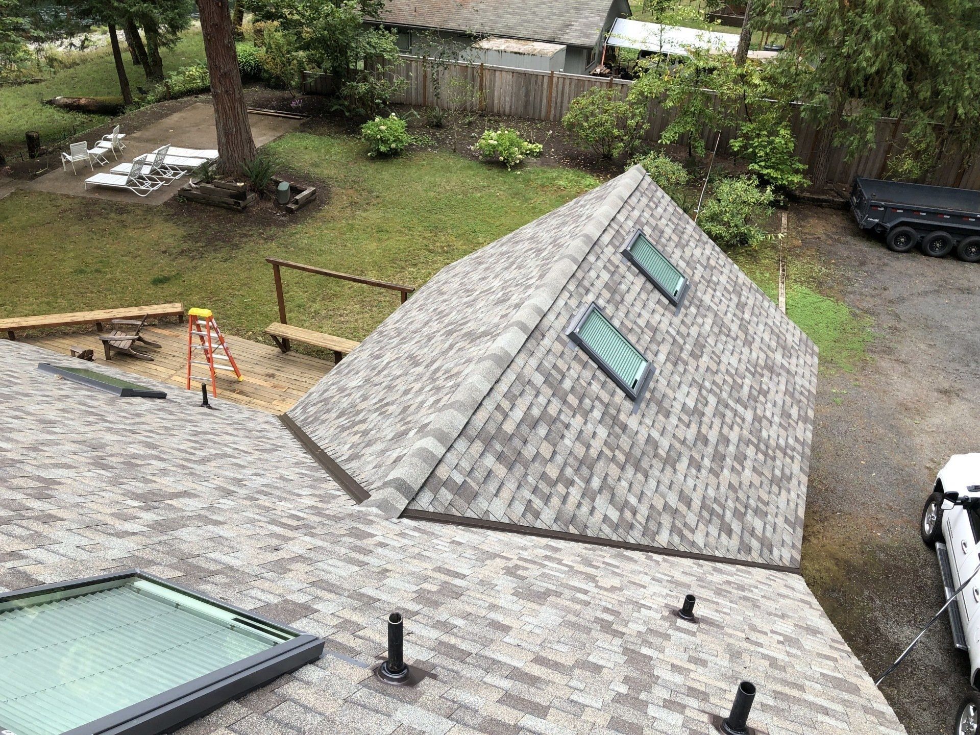 Grey shingled roof with skylights