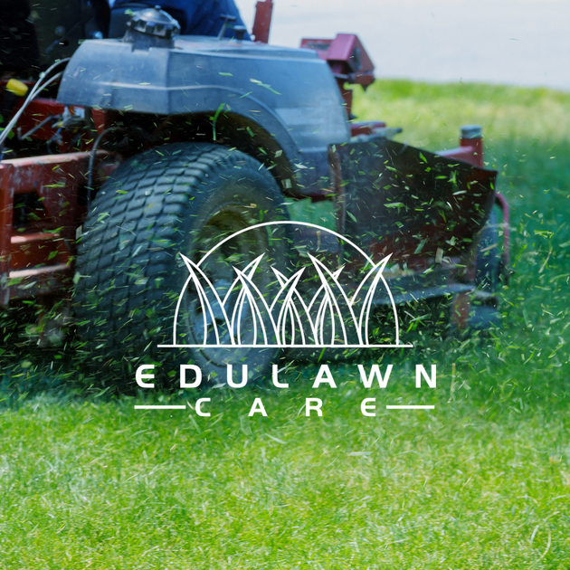 Riding lawnmower cutting grass with EduLawn Care logo in white on top of image
