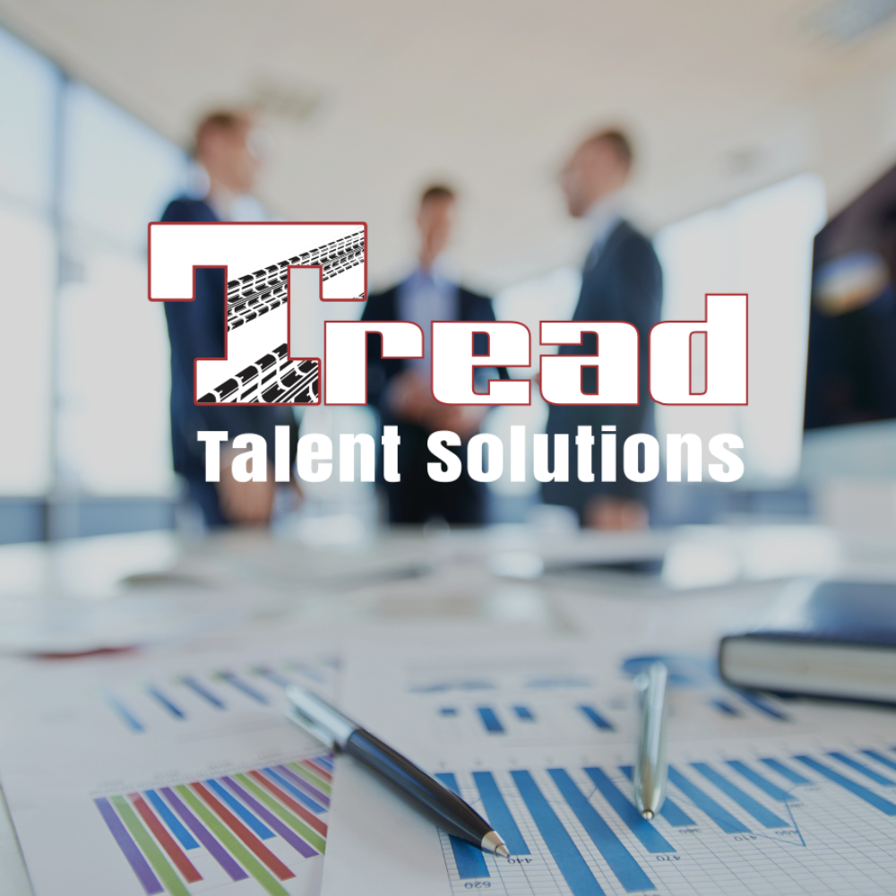 Tread Talent Solutions logo over a blurred office meeting scene with charts and a pen on the table