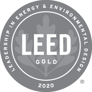 LEED Gold 2020 certification seal: a gray circular badge with text and leaf design.