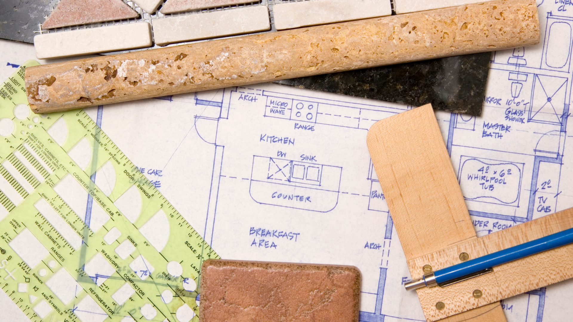 Architectural plans with tile samples, ruler, and a drawing compass.