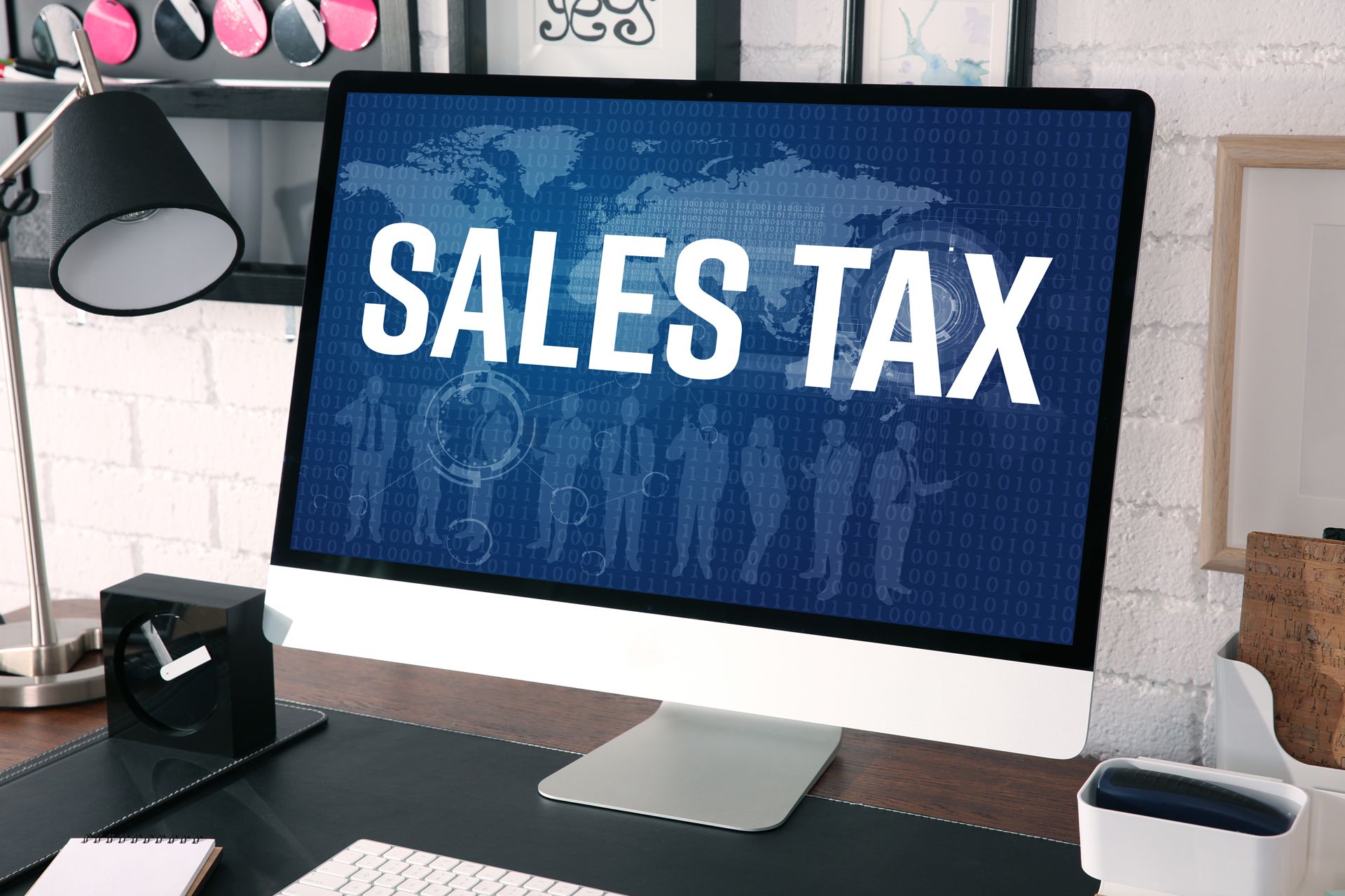 A computer monitor with the words sales tax on it