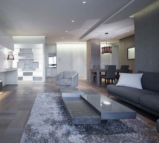 A living room with a couch a chair and a table
