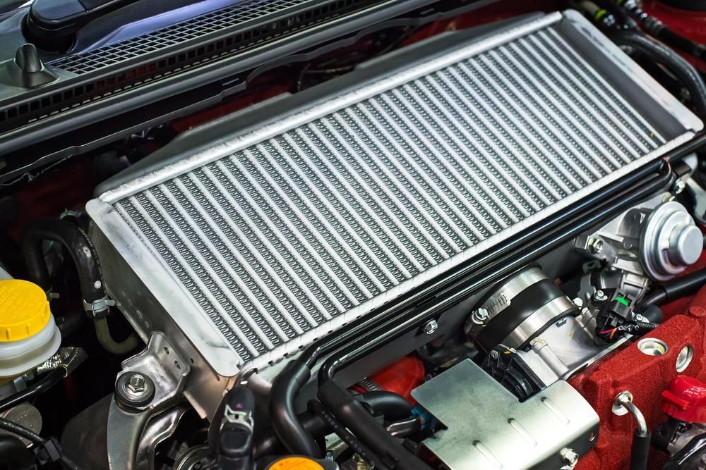 A Close Up of a Car Engine With a Radiator — Cars to Cabs In Wickham, NSW