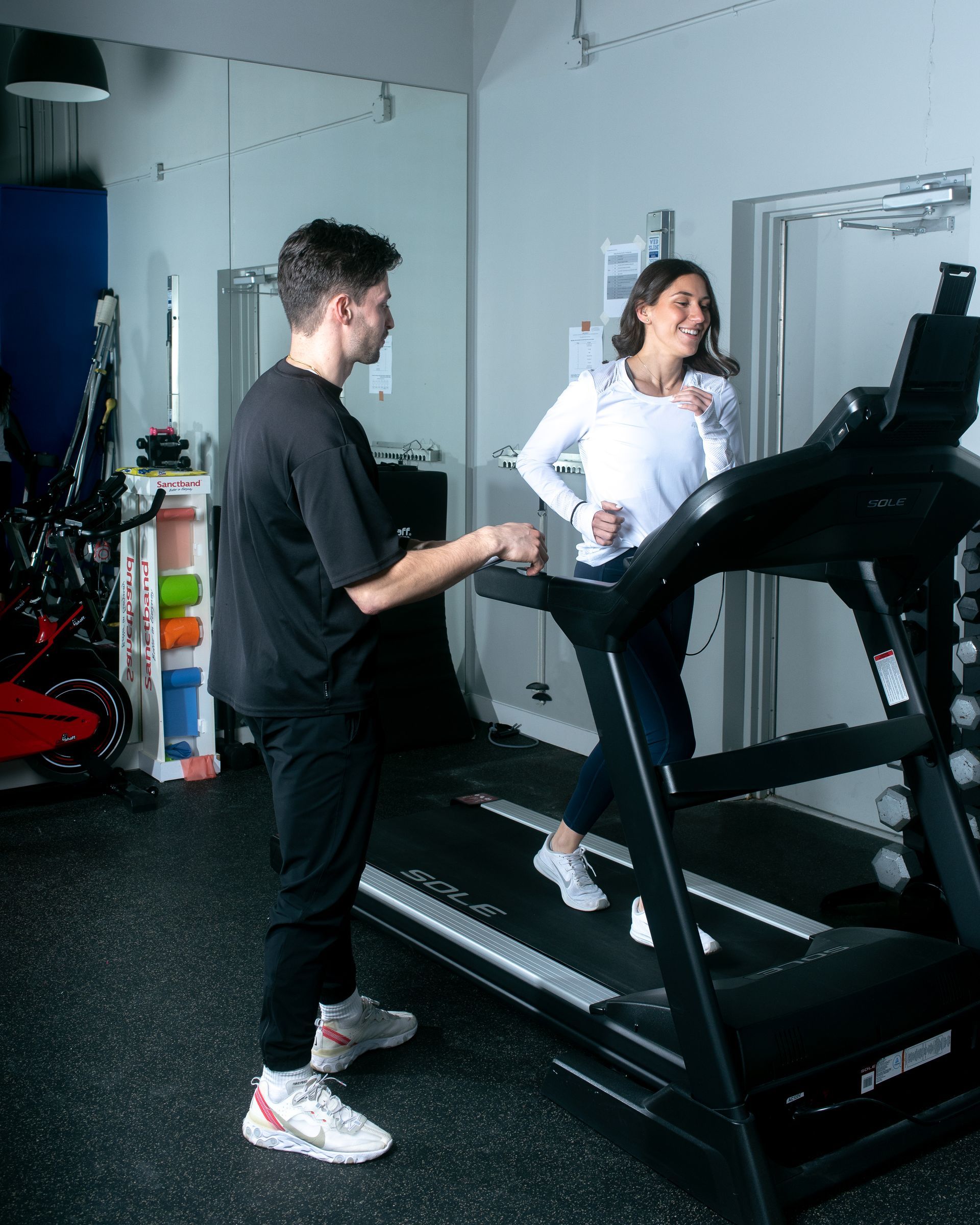 man performing a buffalo Concussion test on a treadmill with a concussed female