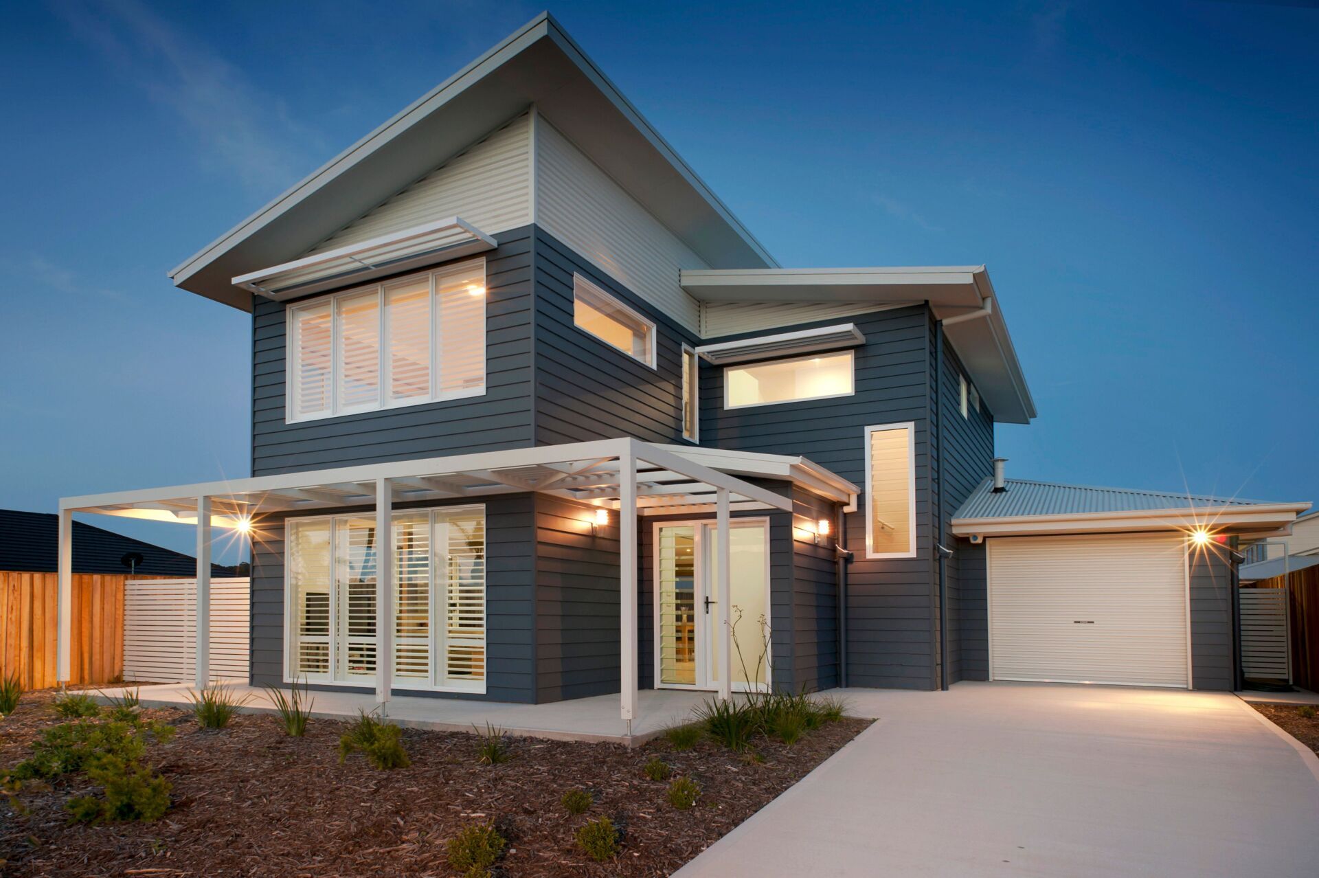 Stone House With Roller Garage Door — Batesman Bay, NSW — Reflex Roller Doors Surfmist Roller Door — Tomakin, Batemans Bay, NSW — Reflex Roller Doors
