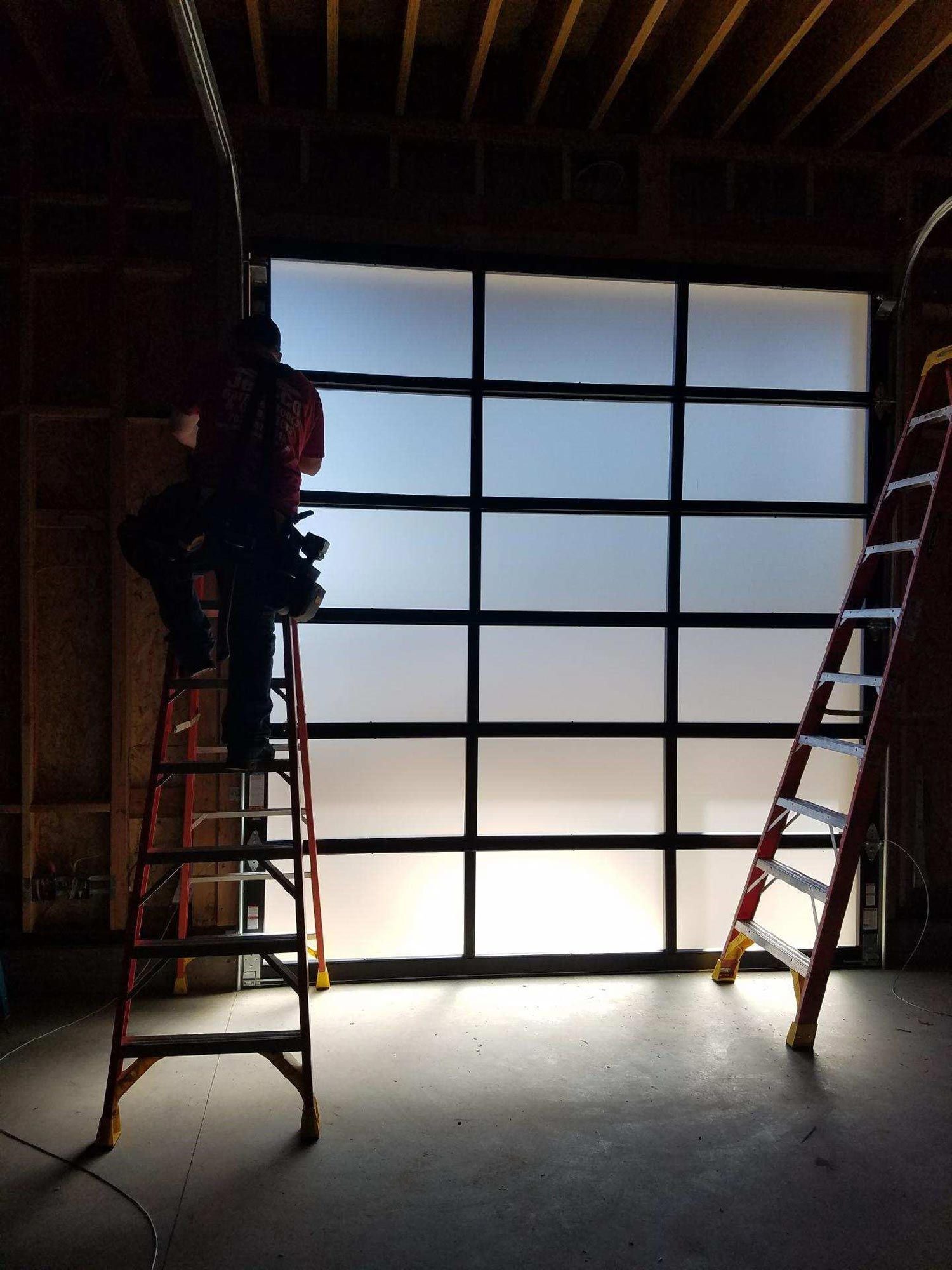 Man Fixing Garage Door — Hidden Valley Lake, CA — Jeri-Co Garage Doors Inc.