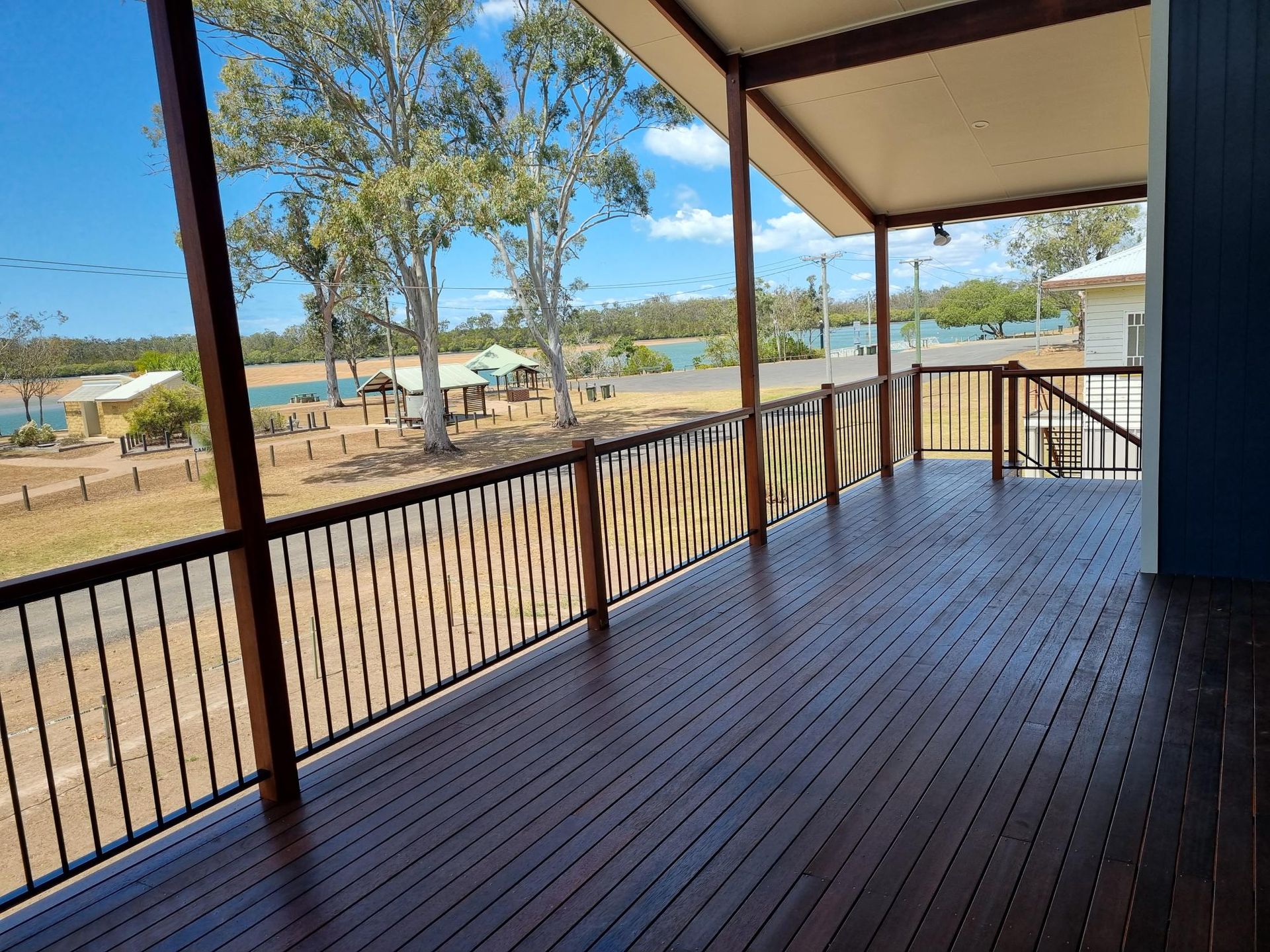 An Empty Balcony With a Railing and Balustrade — RBG Building & Maintenance in Kilkivan, QLD
