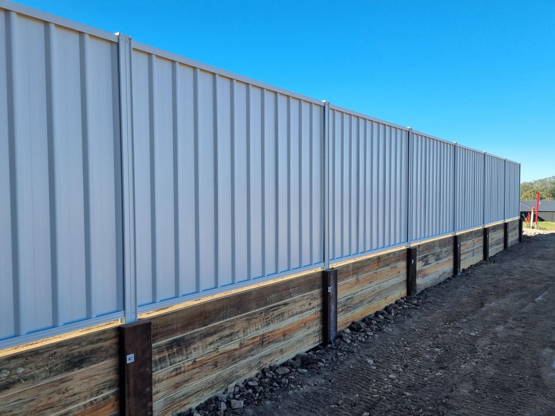 A Concrete Wall With a Glass Balustrading on It — RBG Building & Maintenance in Veteran, QLD