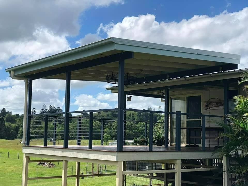 A House With a Large Deck on Top of It — RBG Building & Maintenance in Kilkivan, QLD