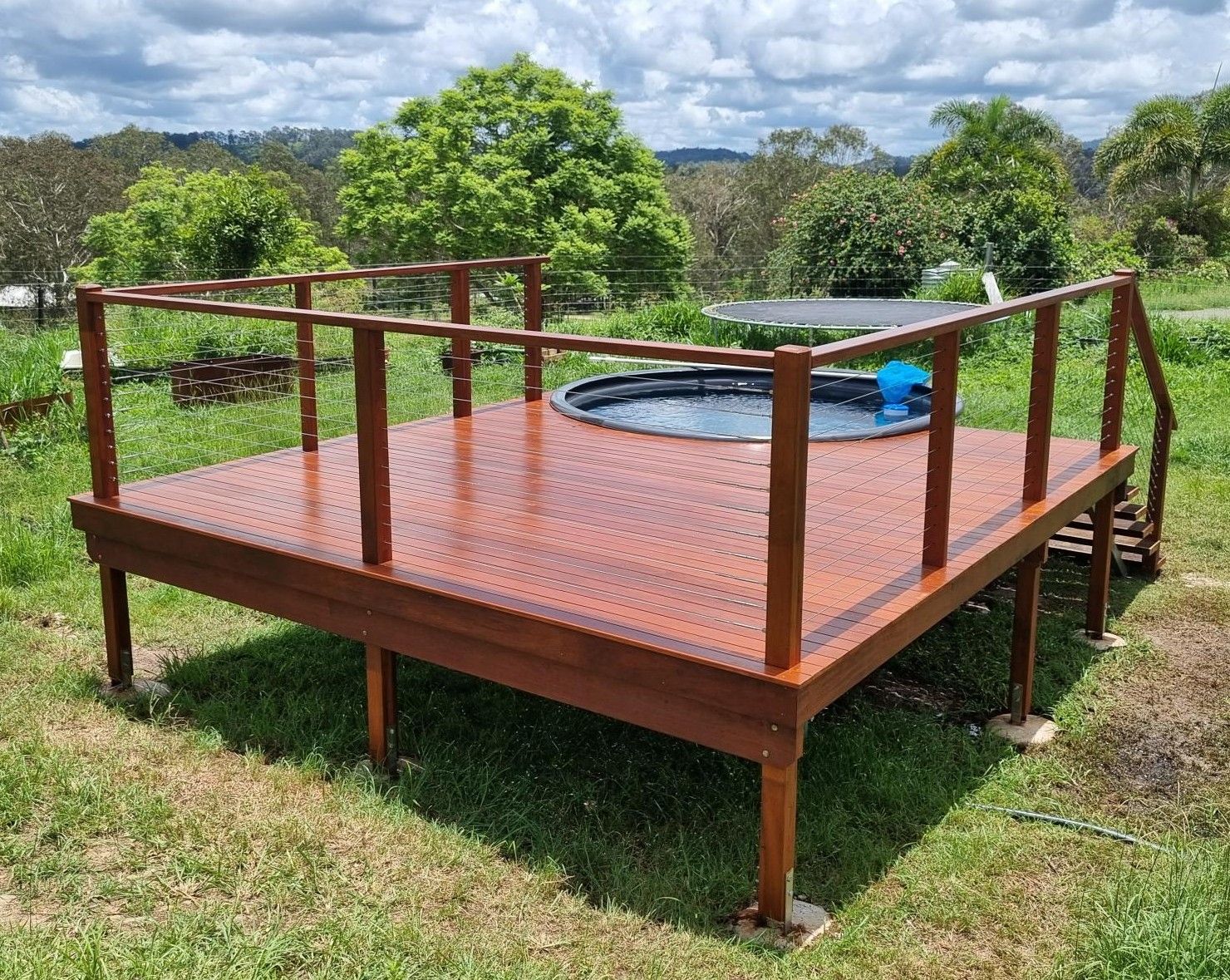 A Concrete Wall With a Glass Balustrading on It — RBG Building & Maintenance in Veteran, QLD