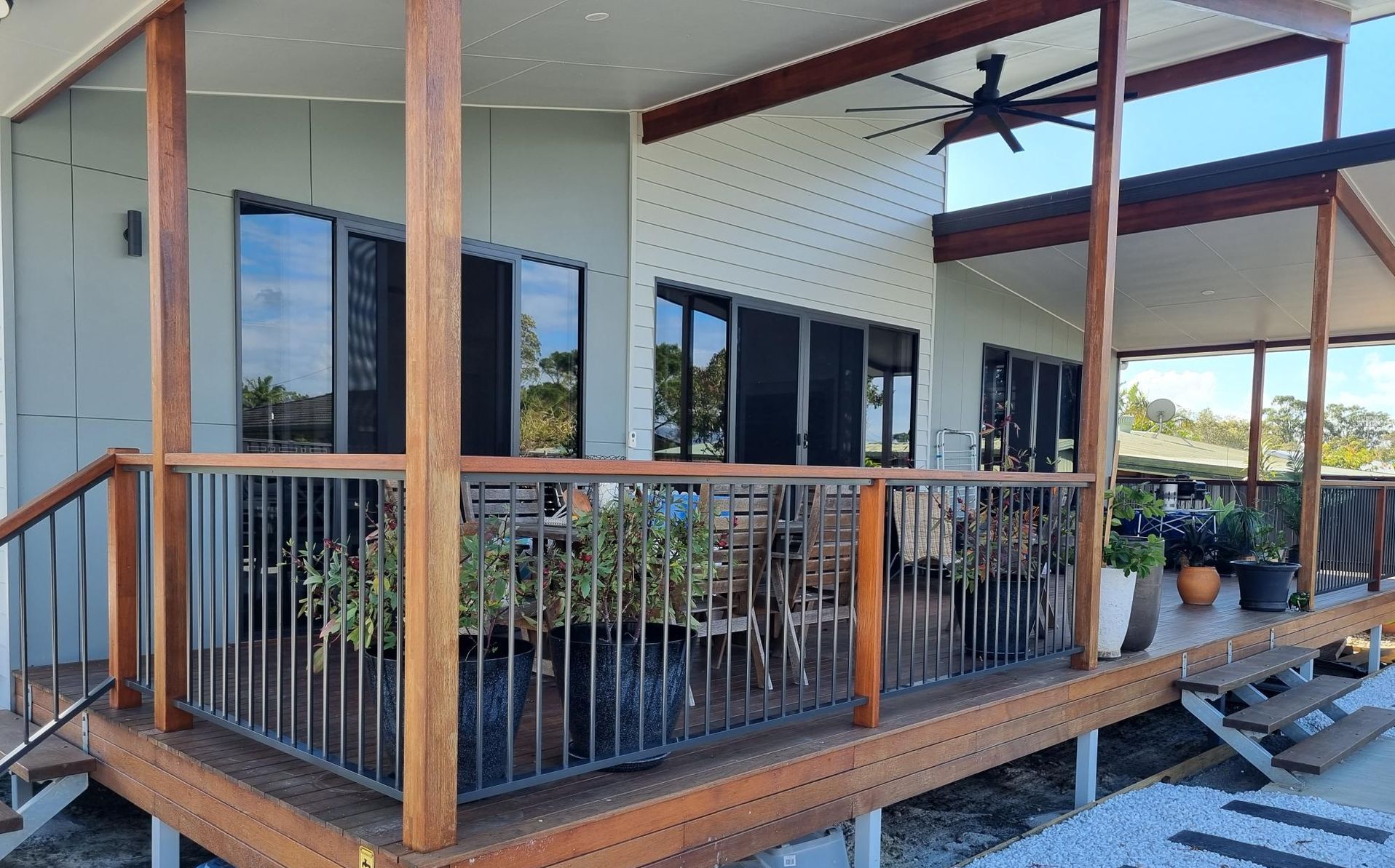 A Porch With a Wooden Deck and Balustrade — RBG Building & Maintenance in Chatsworth, QLD