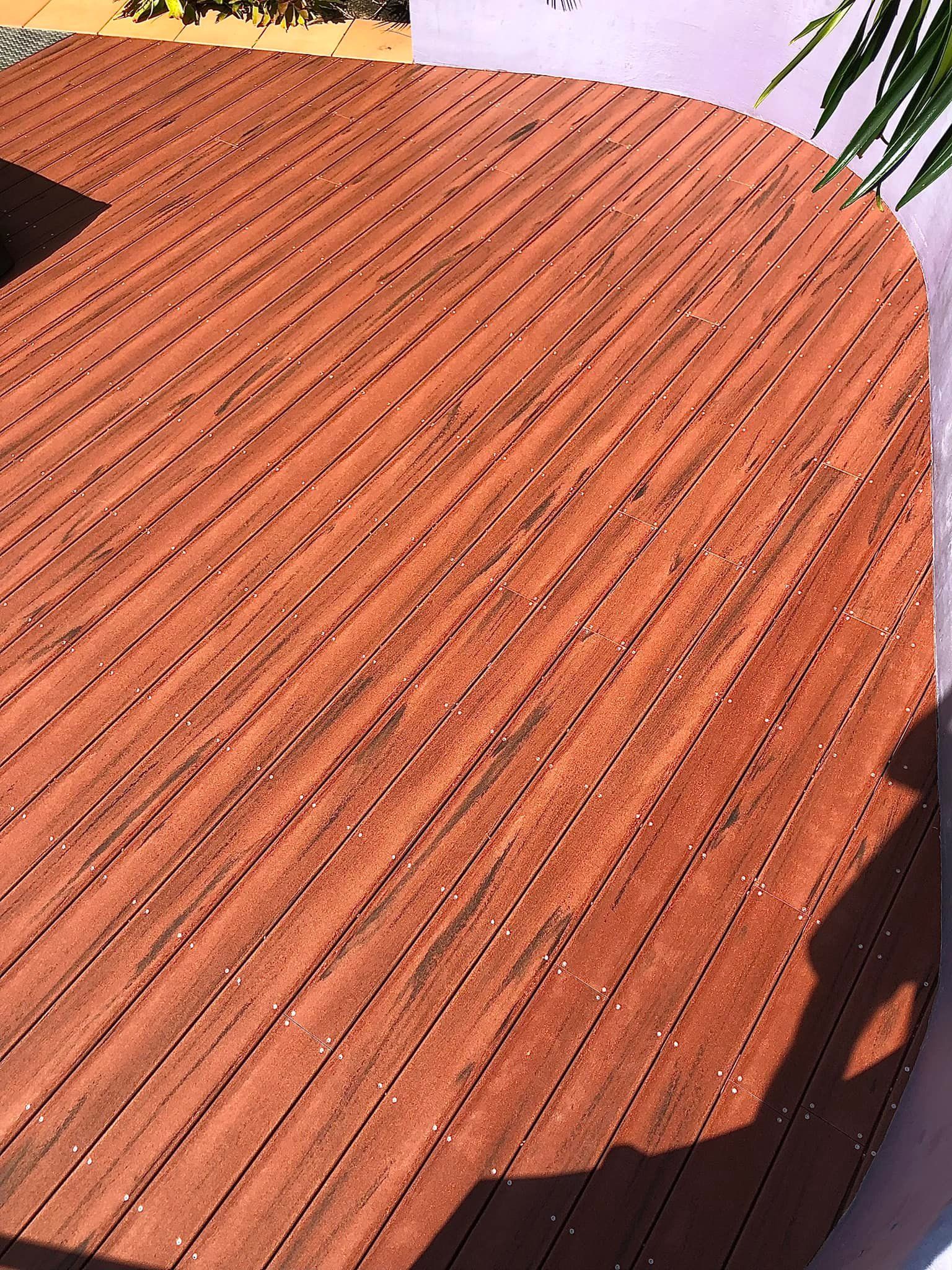 A Man is Working on a Wooden Deck — RBG Building & Maintenance in Mary Valley, QLD