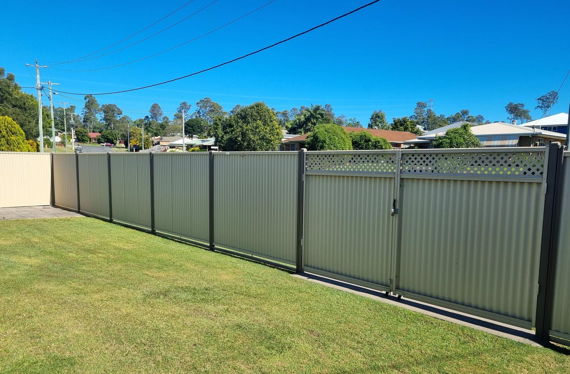 A Large House With a Fence Around It and a Swimming Pool — RBG Building & Maintenance in Chatsworth, QLD