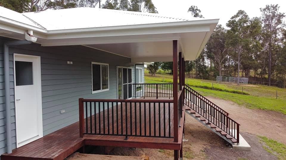 A Balcony With a Glass Balustrade — RBG Building & Maintenance in Veteran, QLD